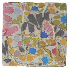 an artistic tile with many different colors and shapes