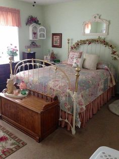 a bed room with a neatly made bed next to a dresser and window sill