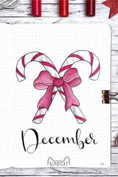 a christmas card with candy canes and the word december written on it