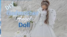 an angel doll is standing in front of a white background with the words, godmother angel doll