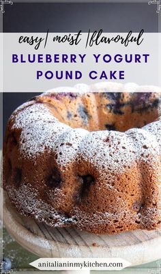 a blueberry yogurt pound cake with powdered sugar on top and text overlay