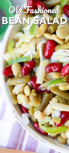 a white bowl filled with beans and other vegetables