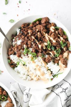 two bowls filled with rice and ground beef