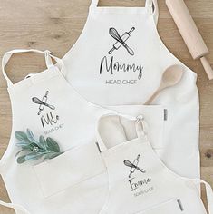 three personalized aprons with spoons and utensils