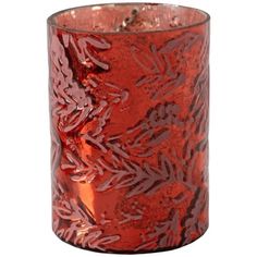 a red glass vase sitting on top of a table