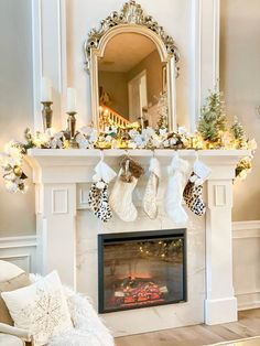 a fireplace decorated with stockings and christmas decorations