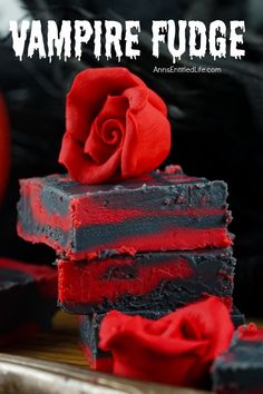 Three pieces of stacked red and black fudge set against a black background. There is a red rose on top Halloween Beach Ball Eyes, Fudge Ideas Fun, Best Halloween Baked Goods, Halloween Finger Foods For Parties Adult, Vampire Treats Party Ideas, Friday The 13 Desserts, Vintage Halloween Desserts, Halloween Treats Baking, Vampire Theme Food