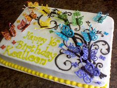 a birthday cake with butterflies on it