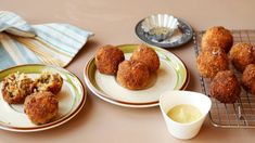 two plates with some food on them next to a cup and saucer in front of it