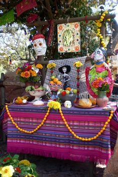 a table with decorations and flowers on it