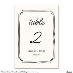 a table number card with the numbers two and three in black ink on white paper