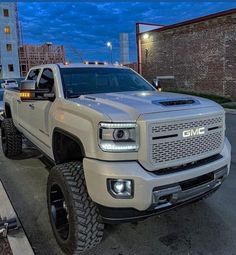 a white truck is parked on the street