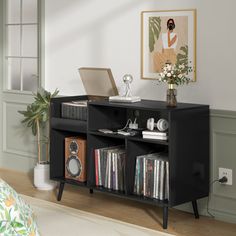 a room with a book shelf and various records