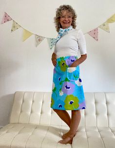 "Elastic Waist Skirt with Front Pocket Size Small/Medium Skirt freatures multi-colored flowers on a blue colored backgound with side front pocket. Size Small/Medium  Waist 26\"-32\" Length 22\" All items are 99% recycled. (some notions must be bought). All items are handmade from vintage sheets. All items are one of a kind. Most of the material used is a cotton/polyester blend that requires little or no ironing. You can expect no shrinkage since all items are made from vintage sheets." Blue Retro Skirt With Floral Print, Retro Blue Floral Print Skirt, Blue Vintage Skirt With Pockets, Vintage Blue Skirt With Pockets, Blue Summer Skirt With Side Pockets, Blue Skirt With Side Pockets, Retro Blue Skirt With Pockets, Retro Blue Knee-length Skirt, Medium Skirt