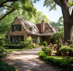 a large house surrounded by lush green trees