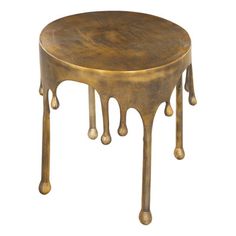 a round table with dripping paint on it