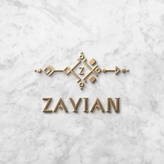 the word zayan on a marble surface with gold letters and an ornamental motif in the middle