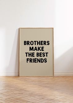 a framed poster with the words brothers make the best friends on it in front of a white wall