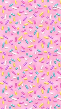 colorful sprinkles on a pink background