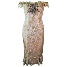 This is a Madalay cocktail dress, it is composed of a gold metallic with a beaded and sequin applique. Features an off the shoulder style with corset boning and a center back zipper closure. In excellent pre-owned condition, shows some signs of wear due to age. Please feel free to ask us any additional questions you may have. Measurements Length: 36.25" Bust: 31" Waist: 26" Hip: 37.5" Gold Off-shoulder Wedding Dress, Gold Embellished Sequin Dress, Gold Sequin Dress With Fitted Bodice, Gold Sequined Dress With Fitted Bodice, Gold Dresses With Sequins And Fitted Bodice, Luxury Gold Strapless Dress, Gold Sequin Cocktail Evening Dress, Gold Sequined Evening Dress For Cocktail, Luxury Embellished Off-shoulder Evening Dress