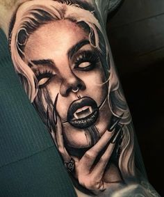 a woman's face with black and white makeup on her arm is shown in this tattoo