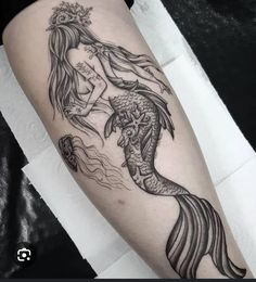 a woman with a mermaid tattoo on her leg