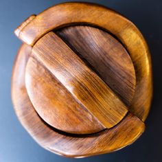 a wooden object that looks like it has been carved into the shape of a circle