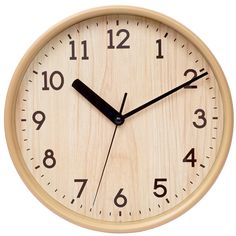 a wooden clock with black hands and numbers on the face, isolated against a white background