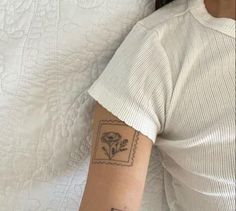 a woman with a small tattoo on her arm