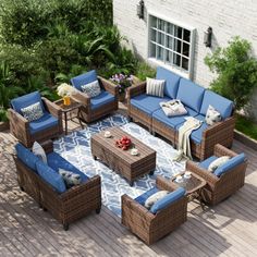 an outdoor patio furniture set with blue cushions