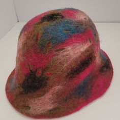 This Adorable Felted Wool hat is made from 100%  high quality  imported wool from New Zealand. It is handmade with wool, warm water and soap.  This hat can be used in Fall and Winter . It is  soft and cozy! It's a practical item to make your fall and winter outfit stand out. It can be easily matched with any style. Comfortable fit. Foldable, crushable & easy to pack.  It can be a great gift for you Loved one. One size to fit average woman's head. The diameter of the hat is 7 inches.  CARE: Hand Winter Felt Hat, One Size Fits Most, Winter Felt Hat One Size Fits Most, Winter Felt Hat One Size, Multicolor Wool Hat For Fall, Winter Felt Beanie Hat, Warm Adjustable Wool Hat, Brimmed Multicolor Hats For Fall, Multicolor Brimmed Hats For Fall, Multicolor Brimmed Fall Hats