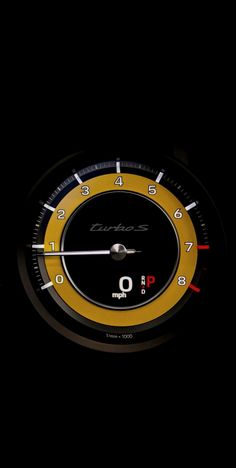 the speedometer is lit up in the dark with yellow and red numbers on it