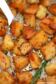 cooked potatoes with herbs and seasoning in a pan