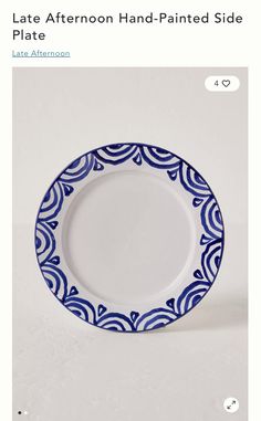 a blue and white plate sitting on top of a table