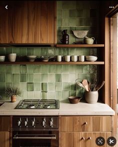 a stove top oven sitting inside of a kitchen next to wooden cabinets and counter tops