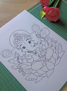 an image of a drawing on paper with roses in the background