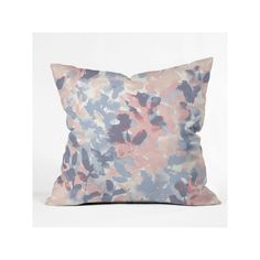 a pink and blue pillow on a white background with an image of flowers in the middle