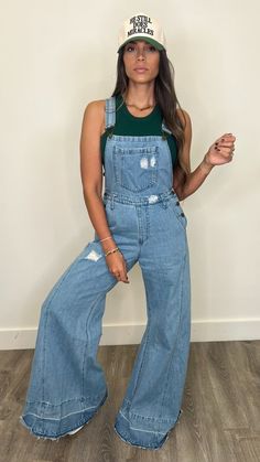 Experience stylish comfort and retro vibes with Marlee Denim Overalls! Featuring a trendy wide leg design, these distressed denim overalls are perfect for any occasion. The buckle closure and adjustable straps ensure a perfect fit, while the kangaroo chest pocket and front/back pockets provide ample storage. Elevate your wardrobe with these versatile overalls!34" Inseam Dark Green Top, Leg Design, Denim Overalls, Green Tops, Retro Vibe, Ribbed Fabric, Casual Wardrobe, Distressed Denim, Chest Pocket