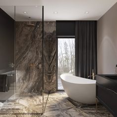 a bathroom with marble walls and flooring next to a bathtub in front of a window