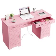 a pink desk with drawers and a laptop on it