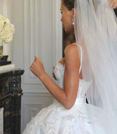 the bride is getting ready to walk down the aisle