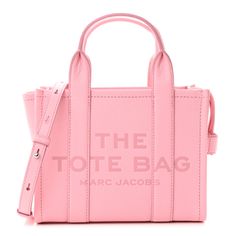 This is an authentic MARC JACOBS Grained Calfskin Small The Tote Bag in Ribbon Pink. This chic tote bag is beautifully crafted of grained calfskin leather in light pink. The bag features top handles, an optional adjustable shoulder strap with silver hardware, and an embossed print on the front. The top zipper opens to a spacious red leather interior with hanging pockets. Marc Jacobs Tote Bag, Medium Tote Bag, Marc Jacobs Tote, Craft Tote Bag, Pink Tote Bags, Small Tote Bag, Pink Tote, Marc Jacobs Bag, Mini Tote Bag