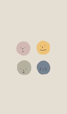 three different colored circles with faces drawn on them