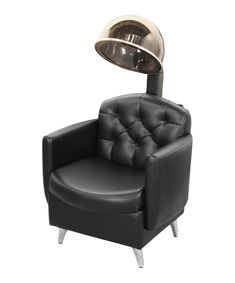 a chair with a lamp on top of it and a black leather arm rest in front of the chair