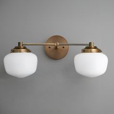 two light fixtures mounted on a wall