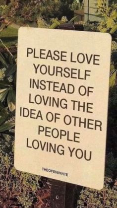 a sign that says please love yourself instead of loving the idea of other people loving you