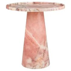 a round marble table with pink and white colors on the top, sitting in front of a white background