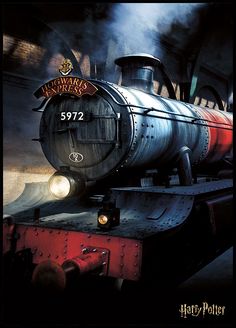 harry potter's hogwarts express train coming down the tracks