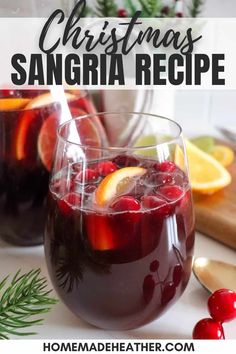 christmas sangria recipe with cranberries and oranges in glasses on a table