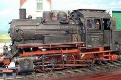 an old fashioned train on display in a museum